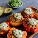 Mexican Quinoa Stuffed Peppers with Yogurt Avocado Sauce