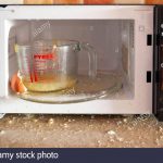 Egg exploded when being boiled in microwave oven Stock Photo - Alamy