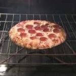 Your question: How do I cook a frozen pizza in a convection oven in the  microwave?