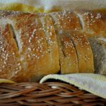 Homemade italian bread with a sesame seed topped crust