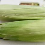 Slide the husk and silk off the corn on the cob | Corn in the microwave,  Cooking sweet corn, How to cook corn