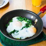 Handful of Spinach and Eggs Over Easy - Improv Oven